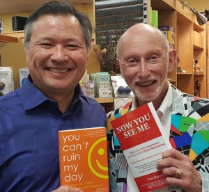 Tom holds Allen Klein's book "You Can't Ruin My Day" and Allen holds Tom's Book "Now You See Me."